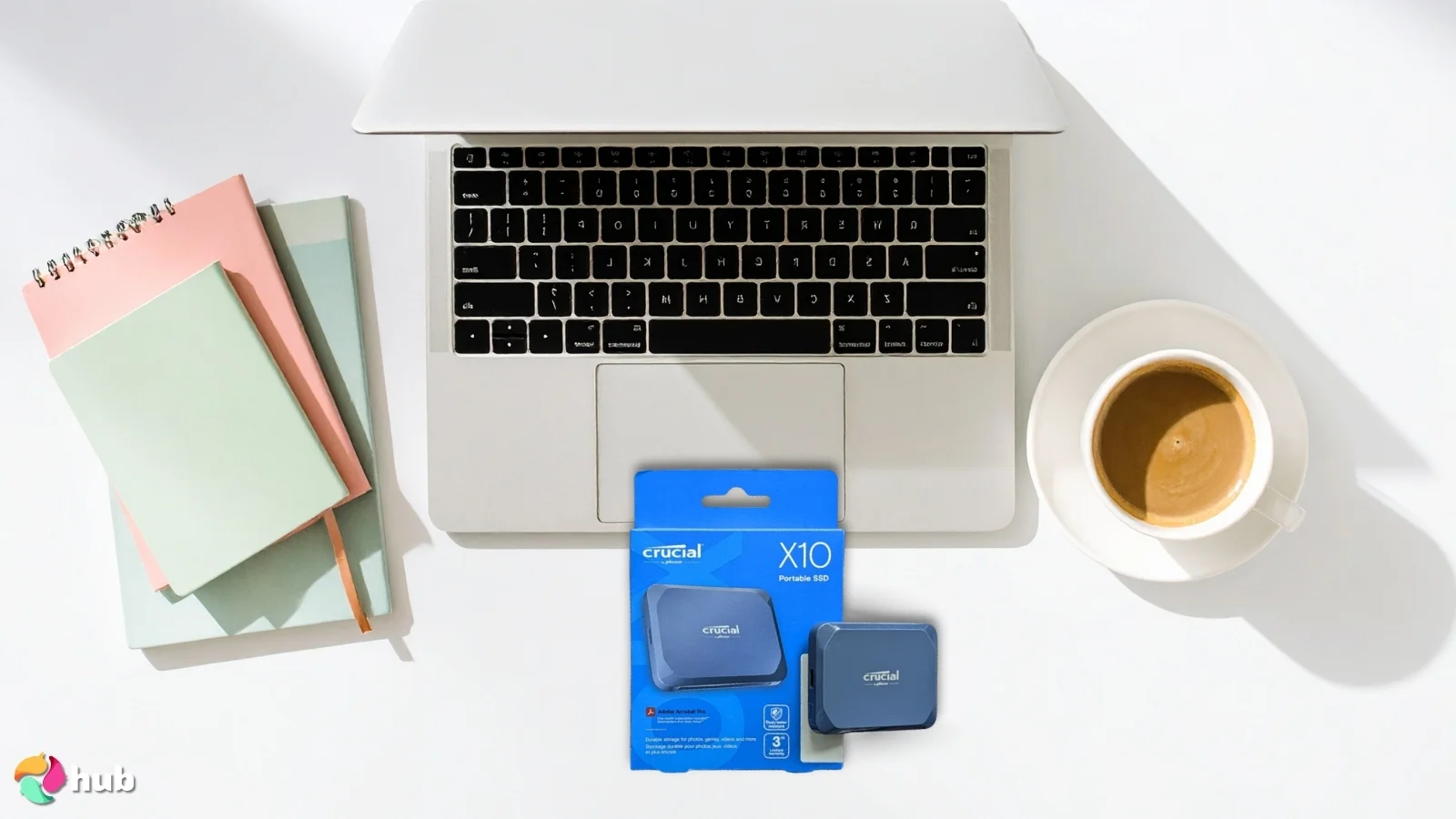 Crucial X10 SSD External Hard Drive on a white office desk with neat arrangement for a review