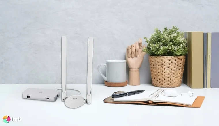 Deeper Connect Mini VPN Router on a white office desk with creative arrangement for a review