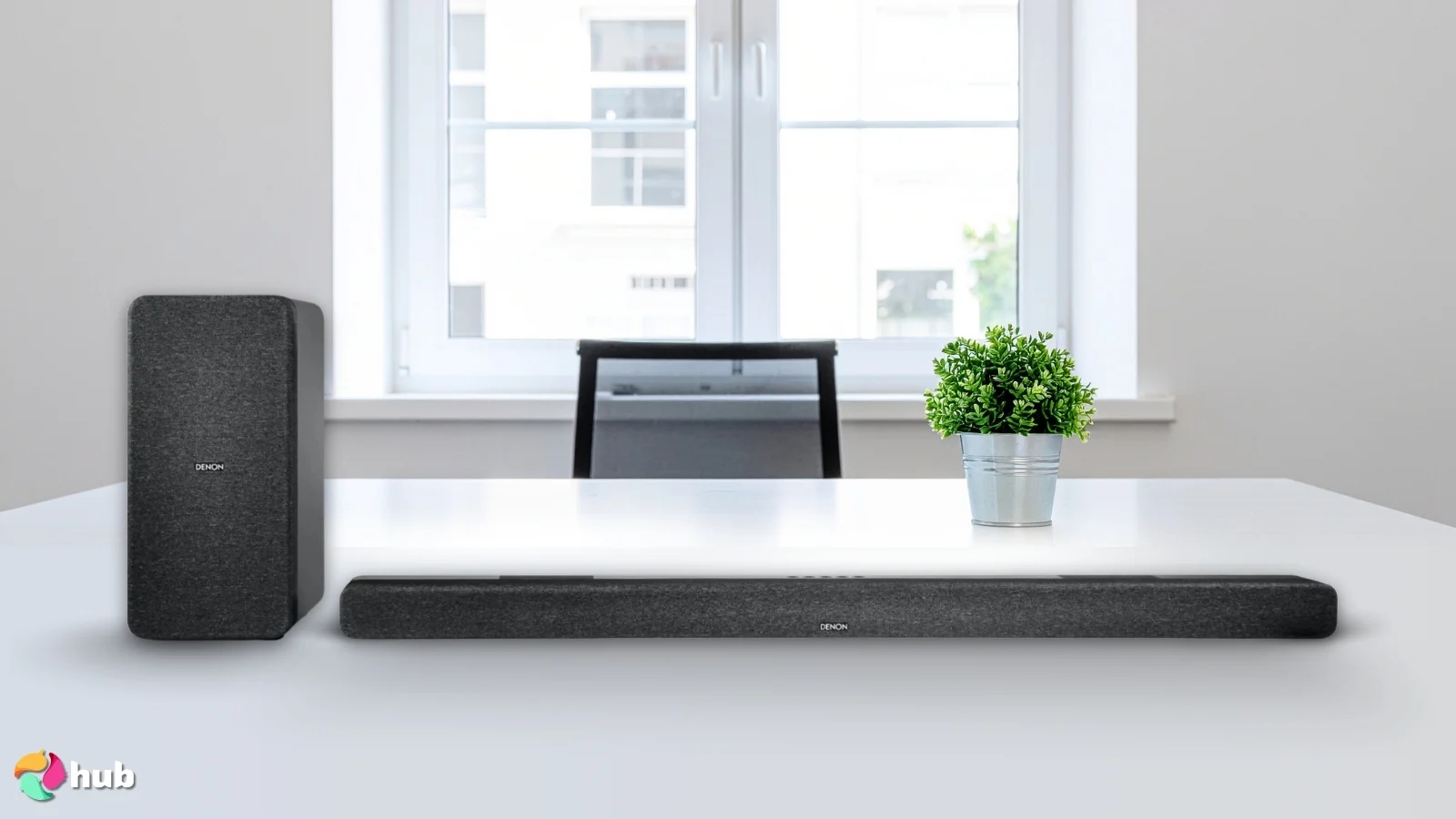 Denon DHT-S517 Soundbar with Subwoofer on a white office desk prepared for testing shots
