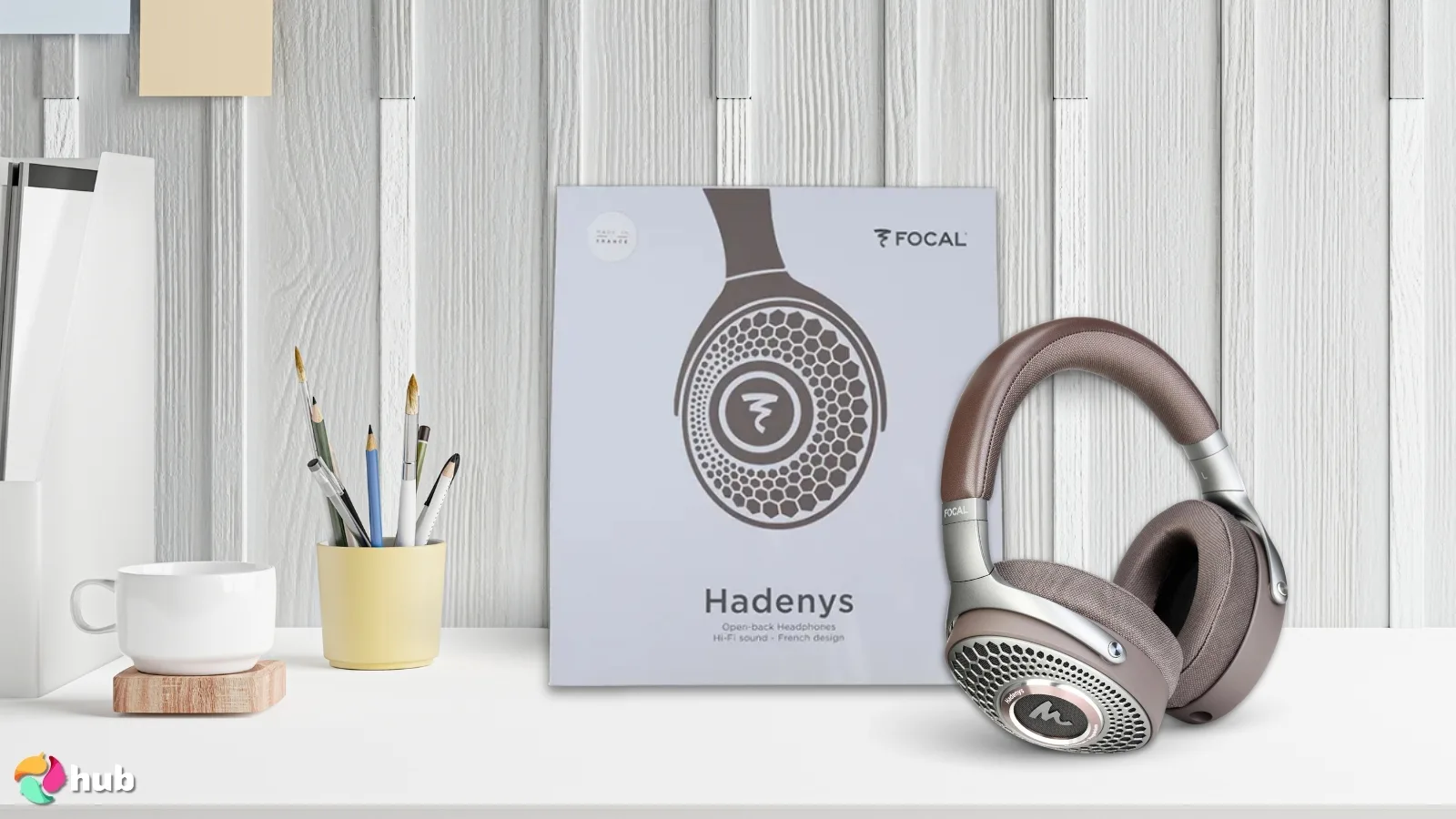 Focal HADENYS High-Fidelity Headphones on a white office desk in a well-lit setting for a review
