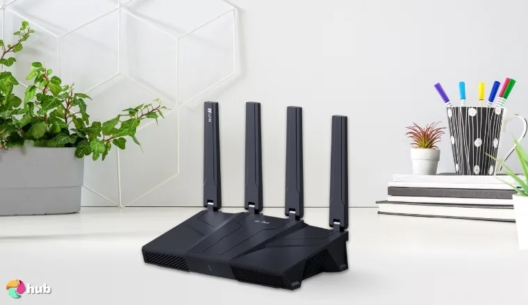 GL.iNet GL-BE9300 (Flint 3) Wi-Fi Router on a white office desk styled for promotional review