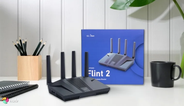 GL.iNet GL-MT6000 VPN Router on a white office desk in close-up for a review