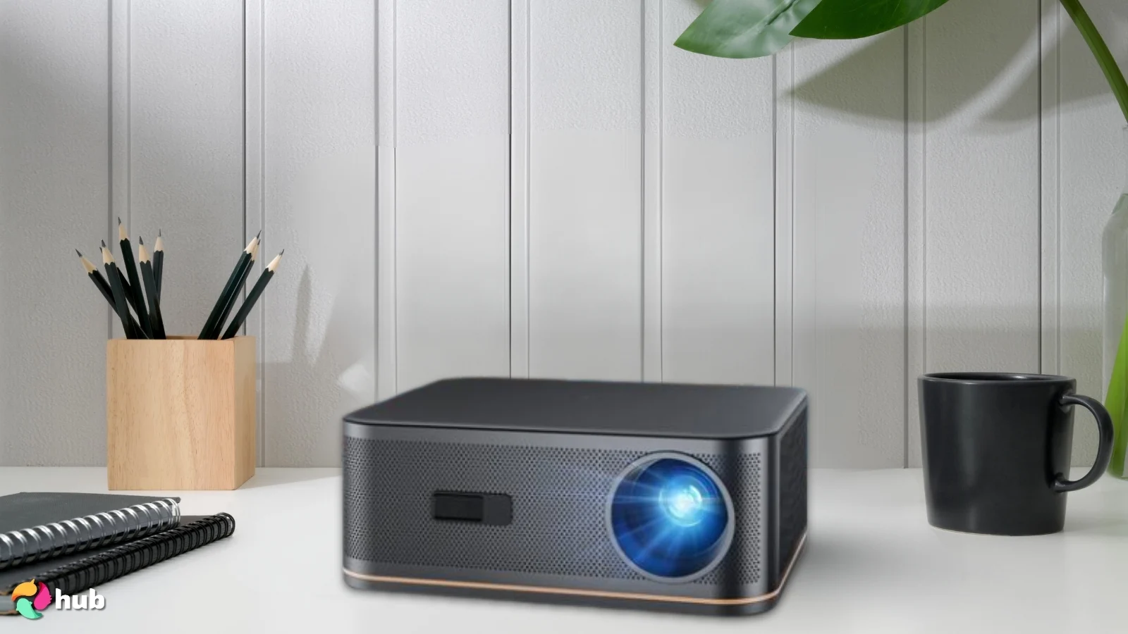 HAPPRUN 4K Full HD WiFi/Bluetooth Projector on a white office desk with neat arrangement for a review