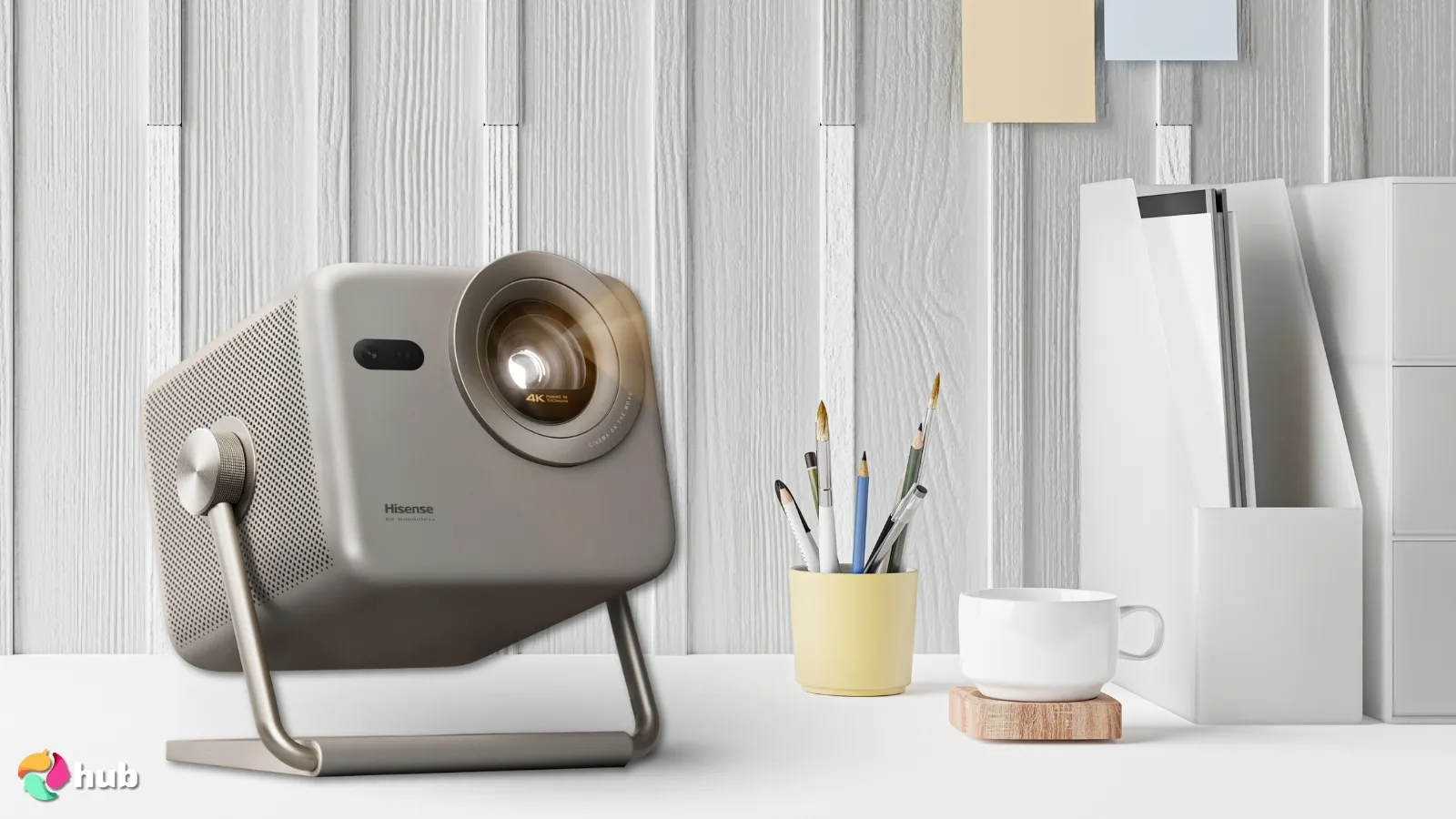 Hisense M2 PRO Projector on a white office desk with professional arrangement for a review