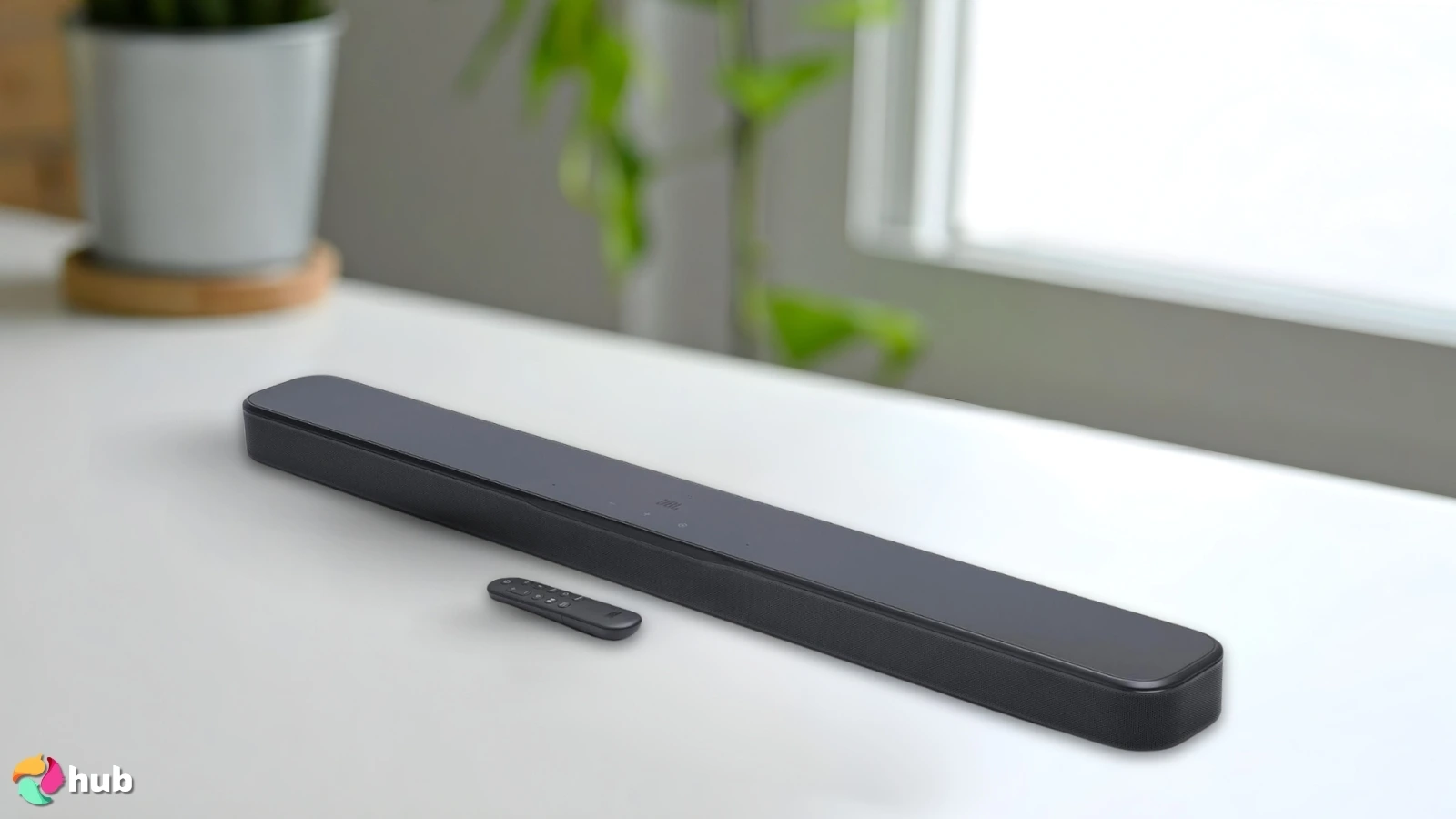 JBL Bar 300 MK2 Soundbar on a white office desk set for a professional product review