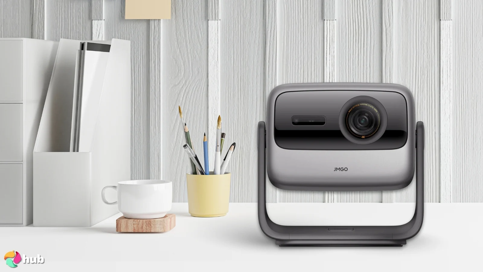 JMGO N1S Pro True 4K Projector on a white office desk with decorative items for a review