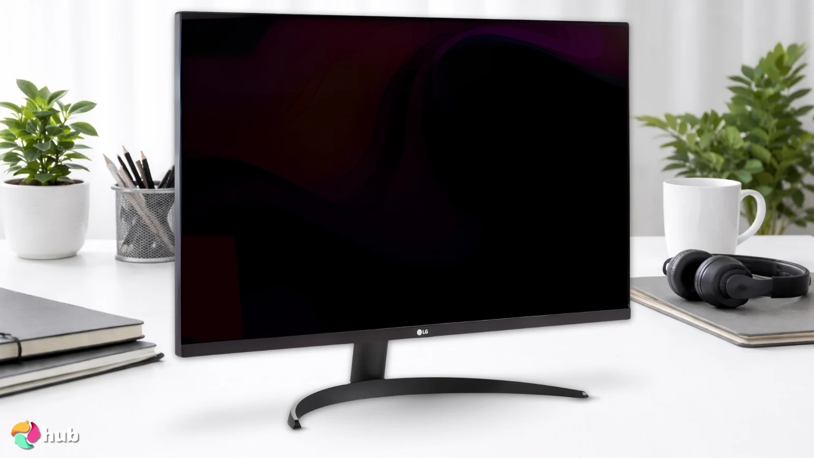 LG 32UR500K-B Ultrafine Gaming Monitor on a white office desk in a well-lit setting for a review