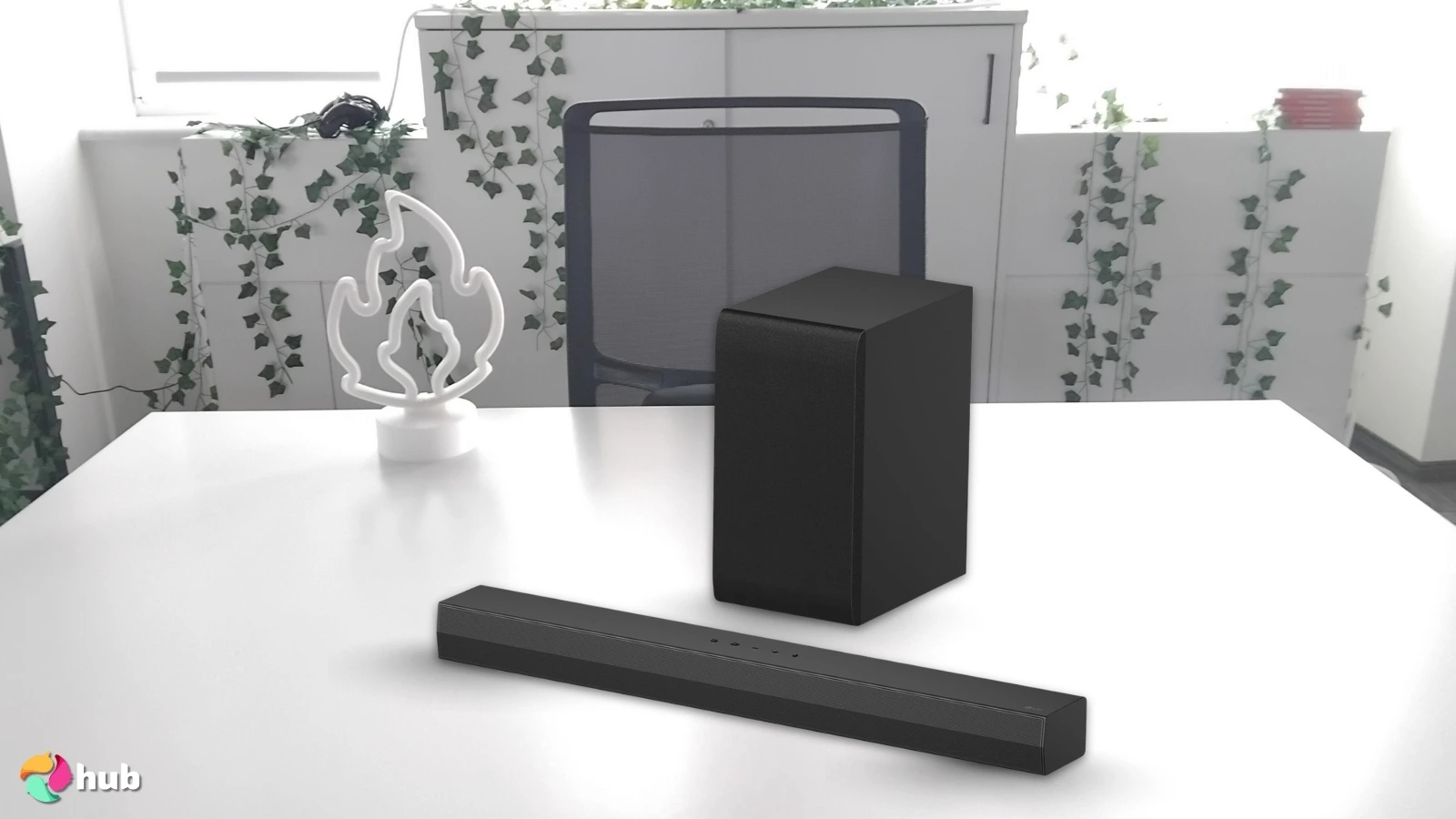 LG S40T Soundbar on a white office desk prepared for product photography