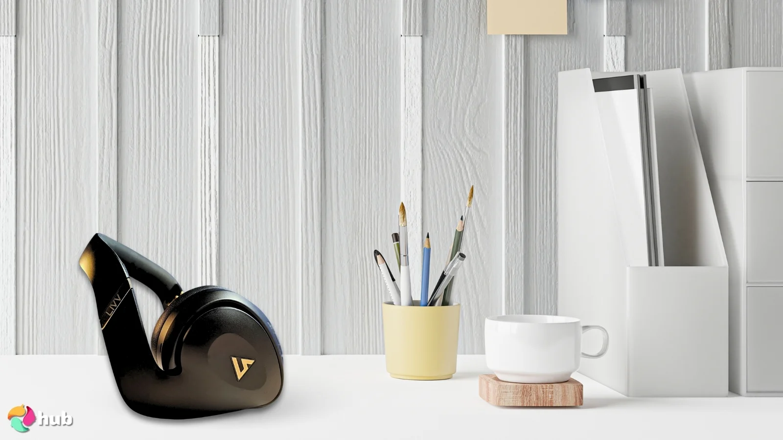 LIVV Pro Headphones on a white office desk set up for testing and review