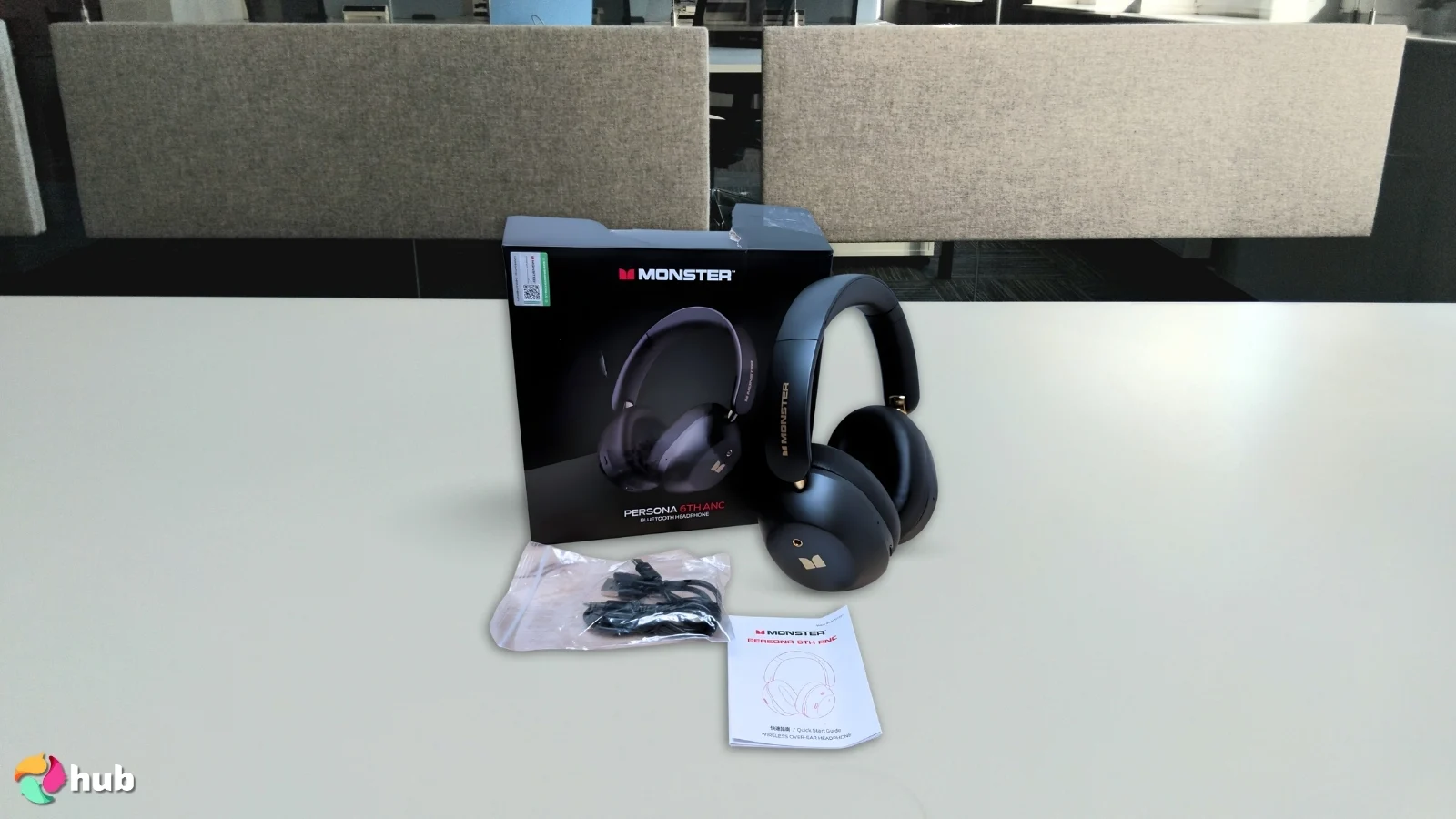 Monster Persona 6th Headphones on a white office desk in a minimalist setup for a review