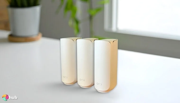 Netgear Orbi 370 Series Mesh Wi-Fi System on a white office desk in a minimalist setup for a review