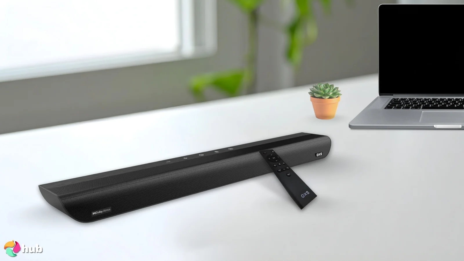 OXS S5 Dolby Atmos Soundbar on a white office desk with minimal decor for a review