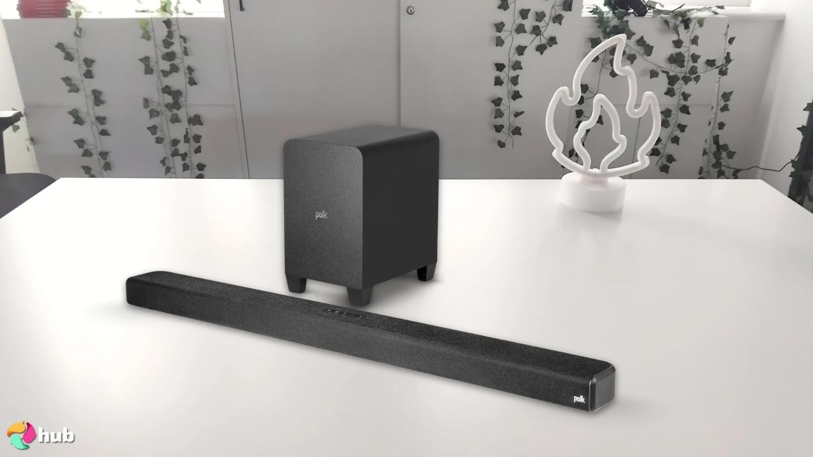 Polk Audio Signa S4 Dolby Atmos Soundbar on a white office desk photographed for a review