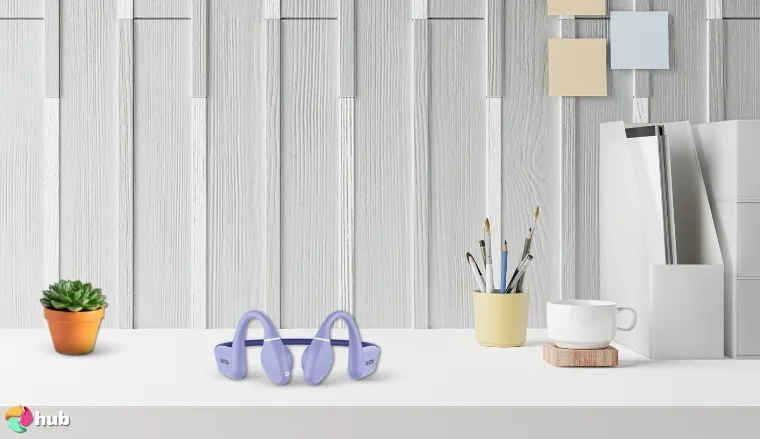 Raycon Bone Conduction Open-Ear Headphones on a white office desk prepared for testing shots