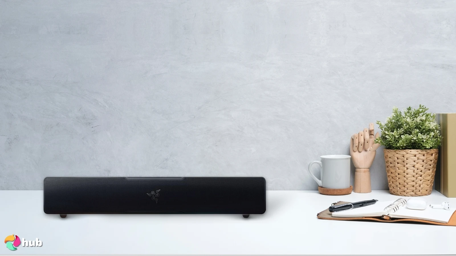 Razer Leviathan V2 X Soundbar on a white office desk with decorative items for a review