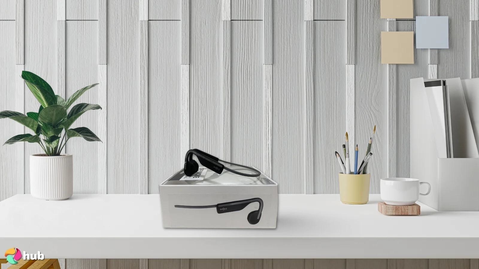SHOKZ OpenMove Headphones on a white office desk with balanced composition for a review