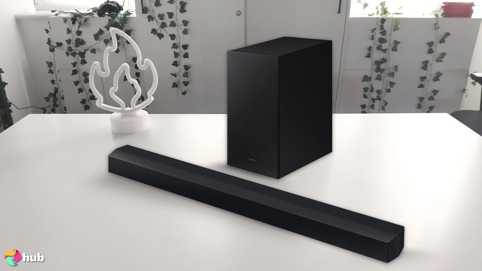 Samsung C450 Soundbar on a white office desk in a minimalist setup for a review