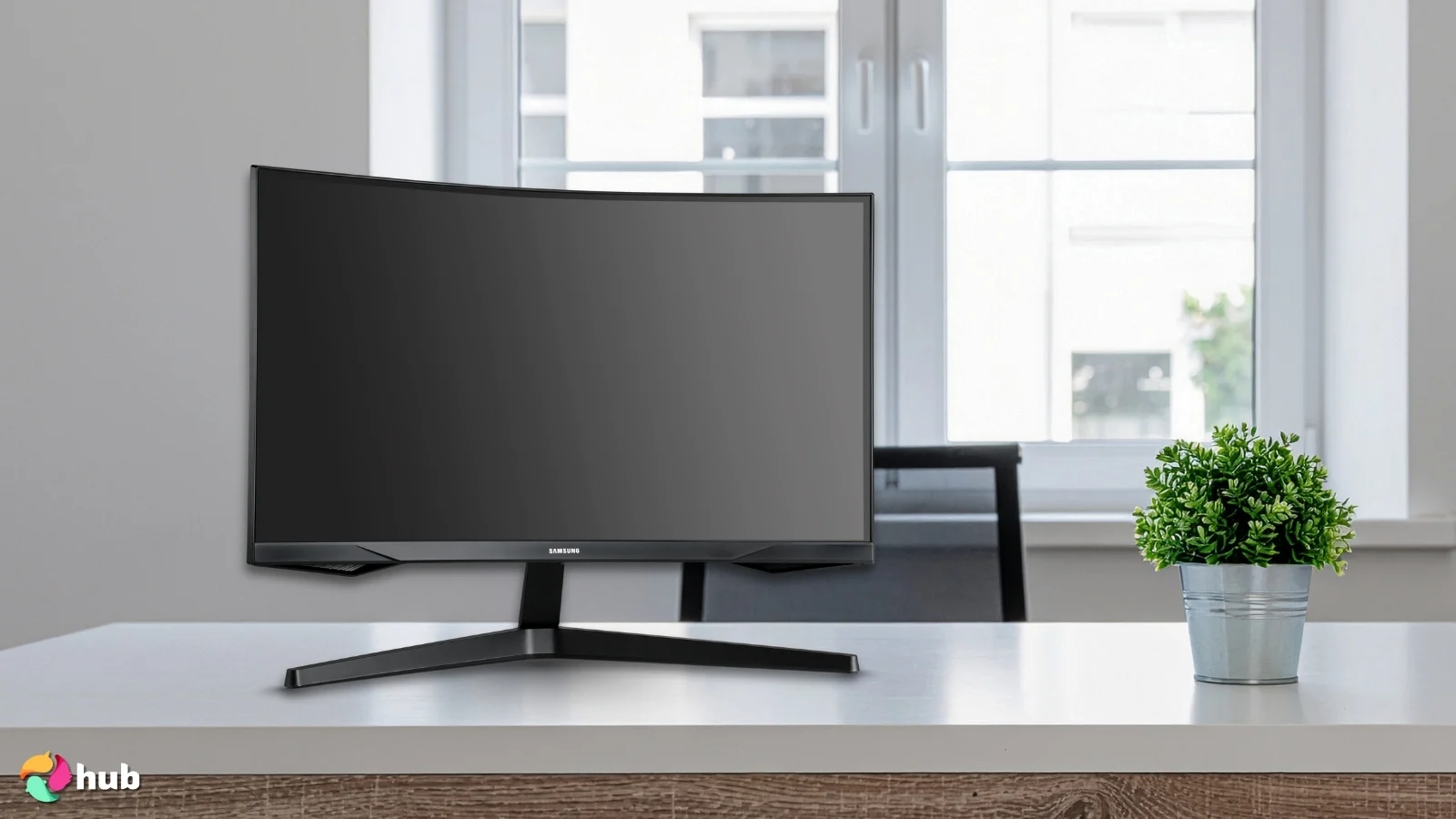 Samsung Odyssey G55C Series Gaming Monitor on a white office desk with simple styling for a review