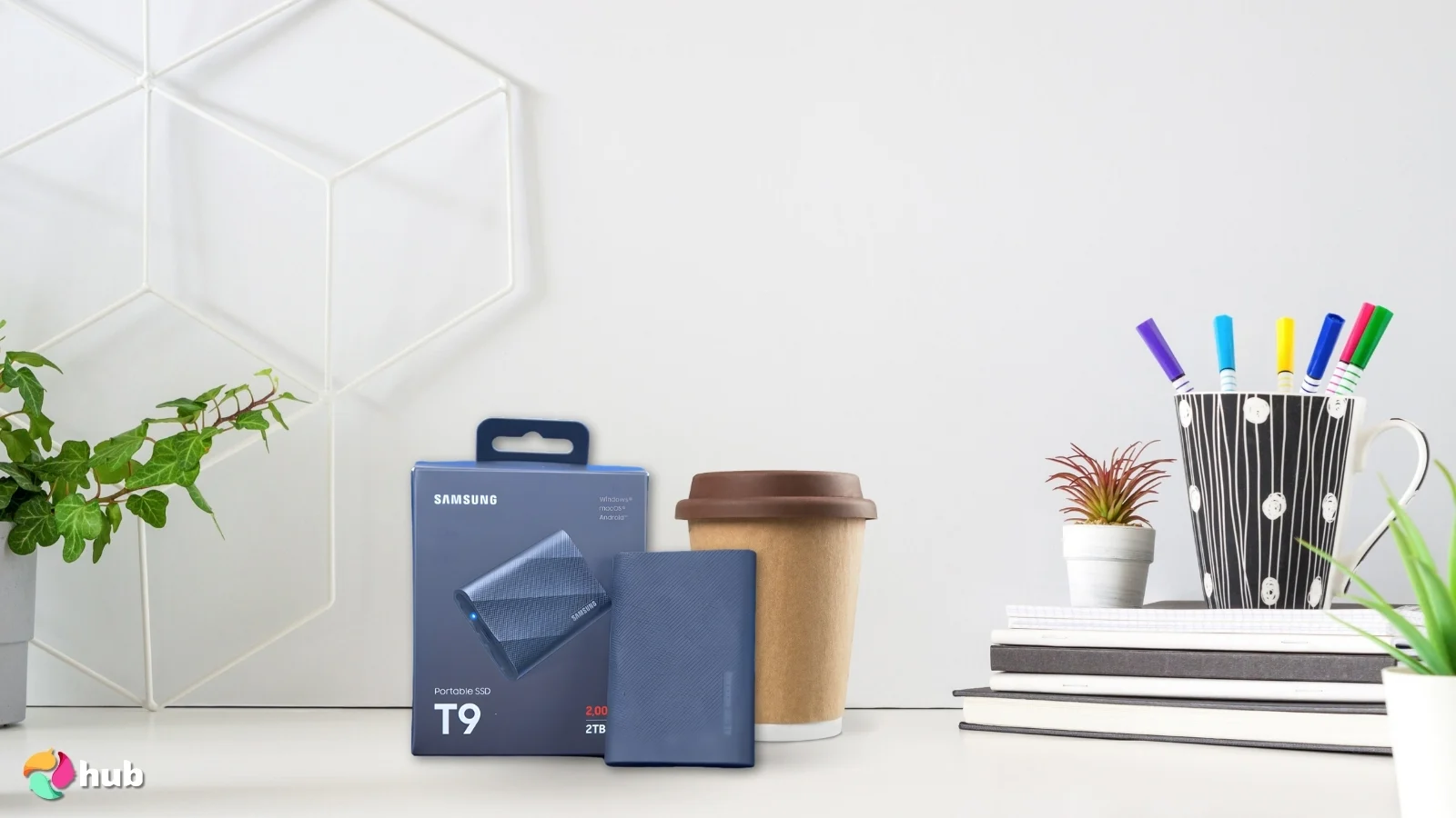 Samsung T9 Portable SSD External Hard Drive on a white office desk with natural shadows for a review