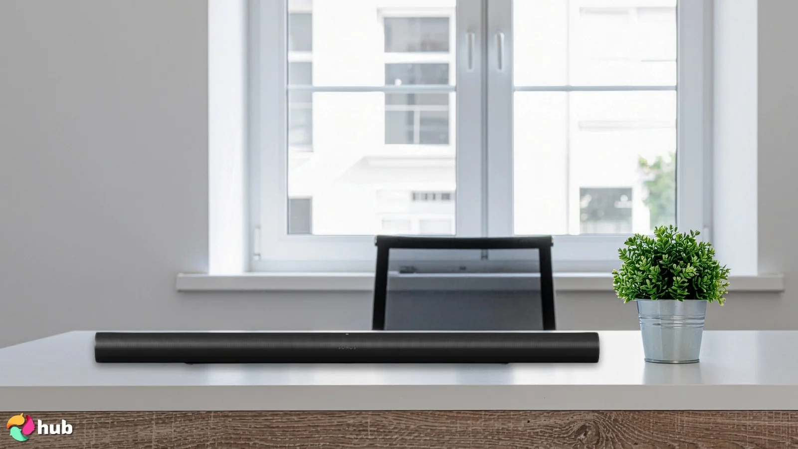 Sonos Arc Ultra Dolby Atmos Soundbar on a white office desk with natural light ready for a review