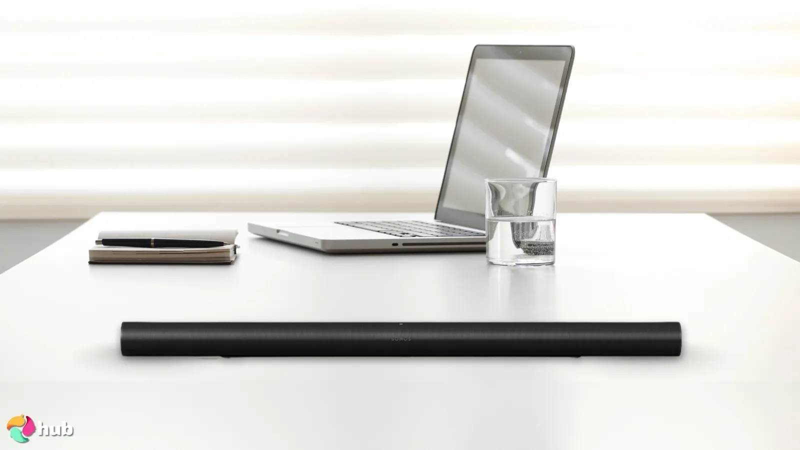 Sonos Arc Ultra Soundbar on a white office desk in a clean setup for a review