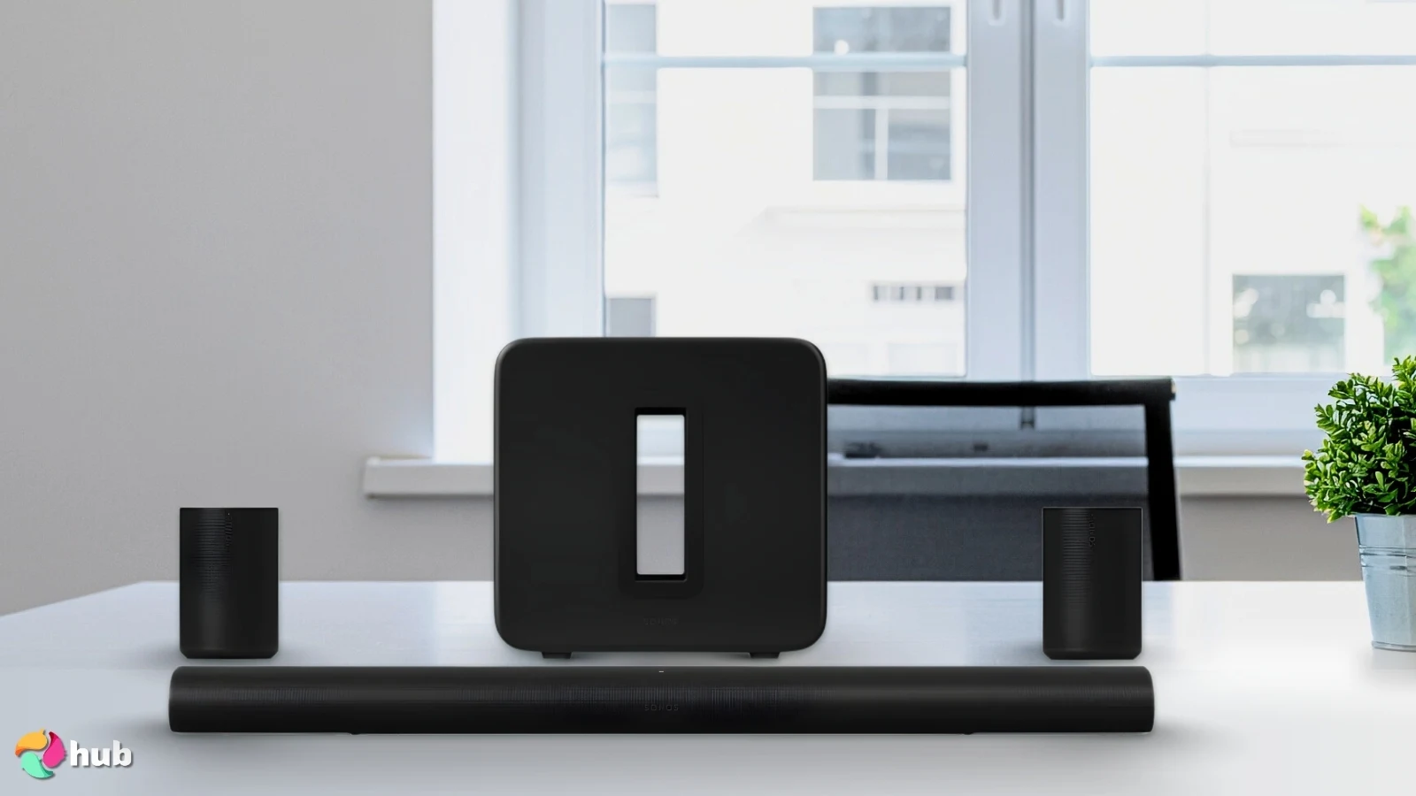 Sonos Arc Ultra Soundbar on a white office desk with soft lighting for a review