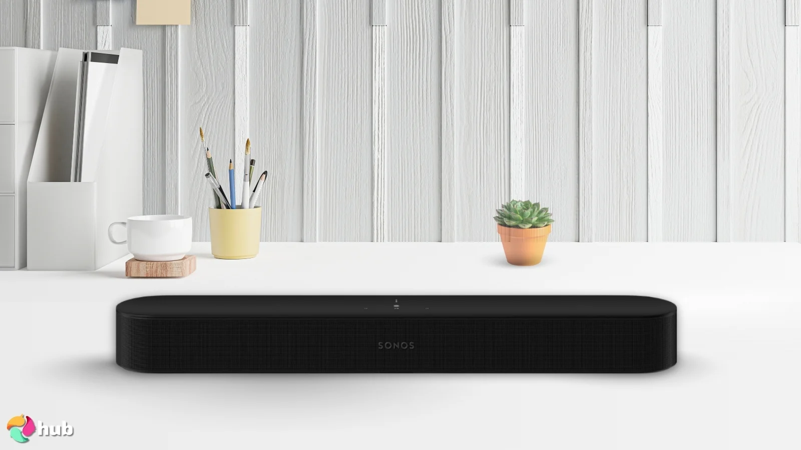Sonos Beam (Gen 2) Soundbar on a white office desk with decorative items for a review