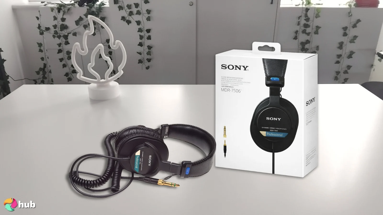 Sony MDR-7506 Headphones on a white office desk styled neatly for a review
