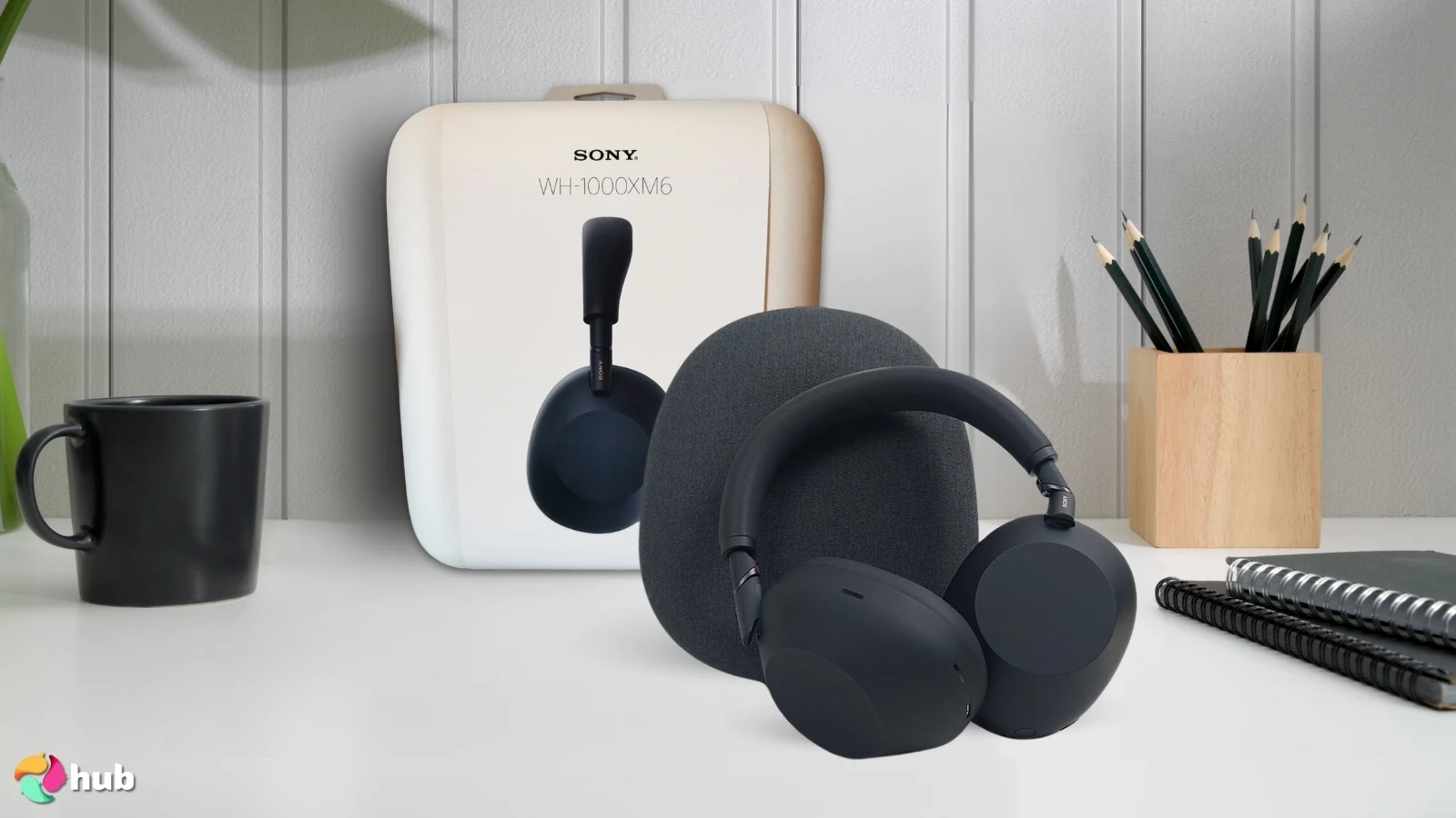 Sony WH-1000XM6 Headphones on a white office desk arranged for a review