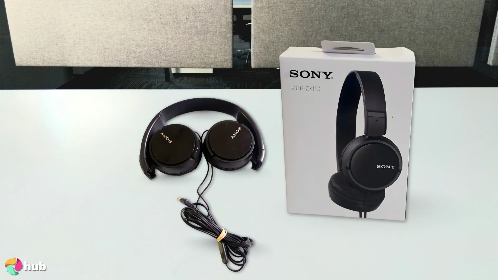 Sony Serie ZX MDR-ZX110 Headphones on a white office desk ready for a product review