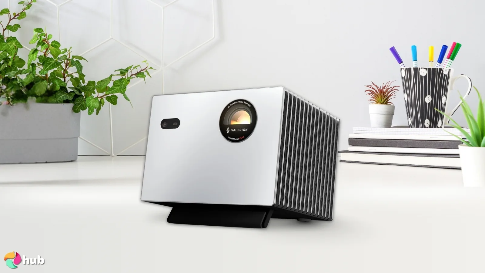 StreamMaster Plus2 Projector on a white office desk positioned for photography