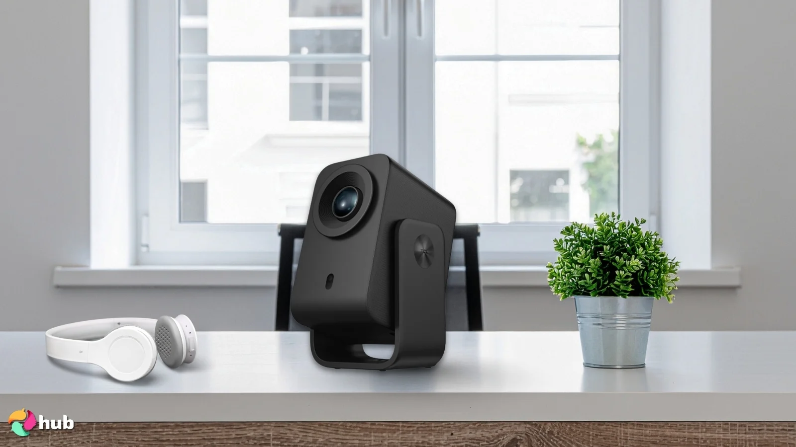 TCL C1 Projector on a white office desk with soft lighting for a review