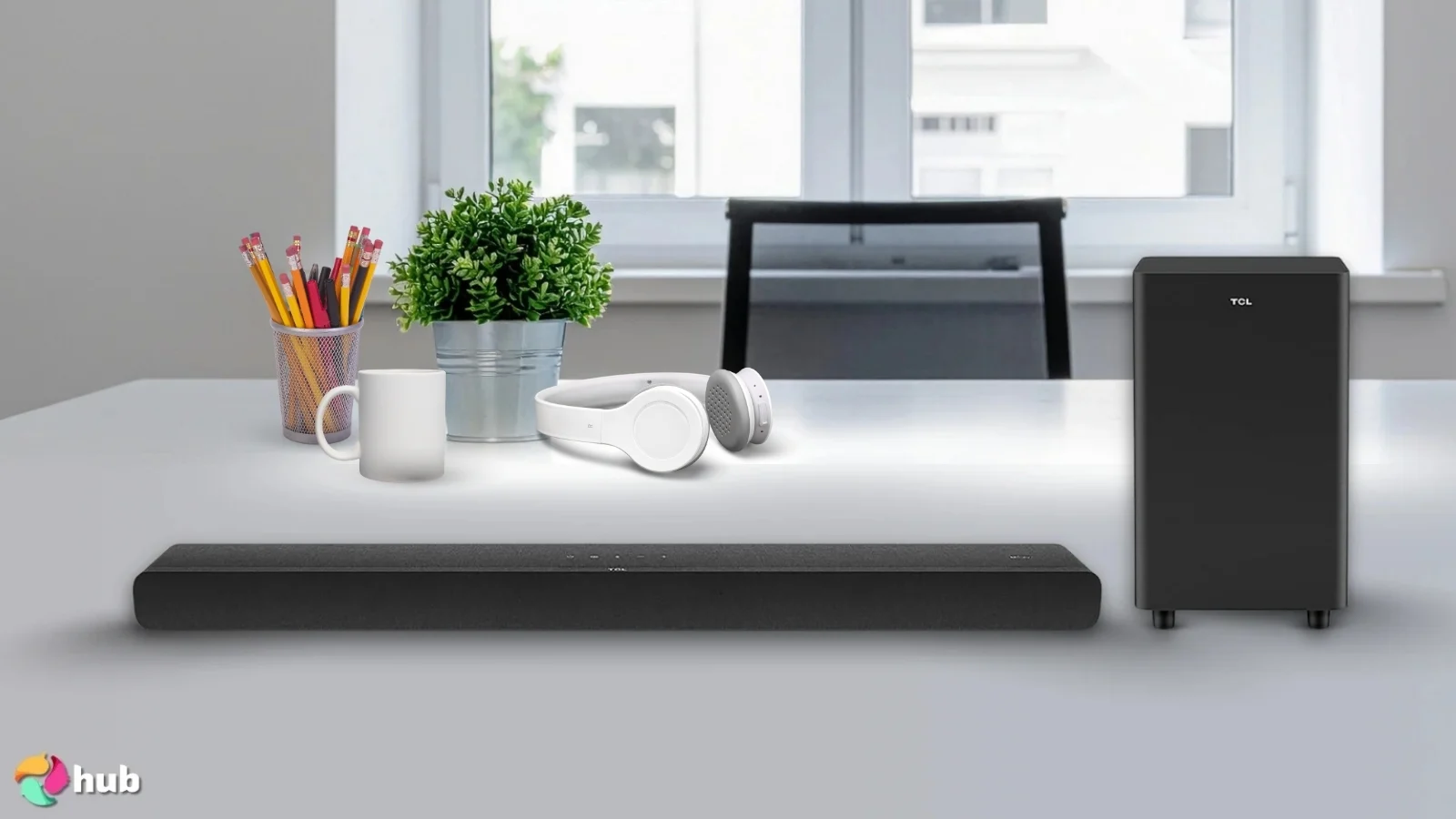 TCL S55H S Class Soundbar on a white office desk with decorative items for a review