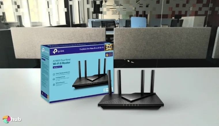 TP-Link Archer AX21 Wi-Fi Router on a white office desk prepared for testing shots