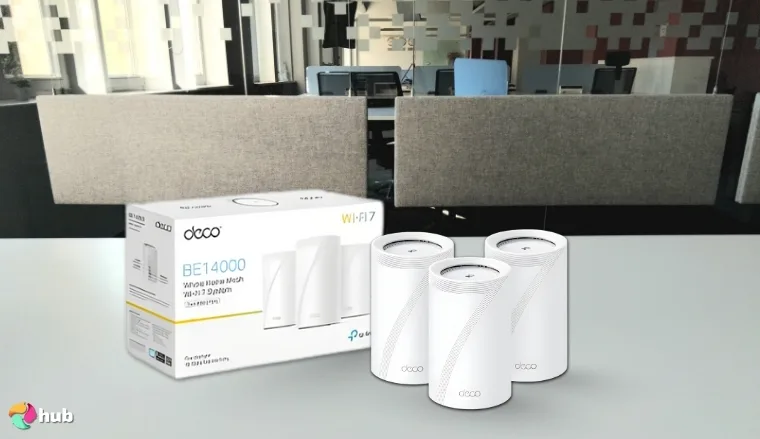 TP-Link Deco BE67 Mesh Wi-Fi System on a white office desk positioned for photography
