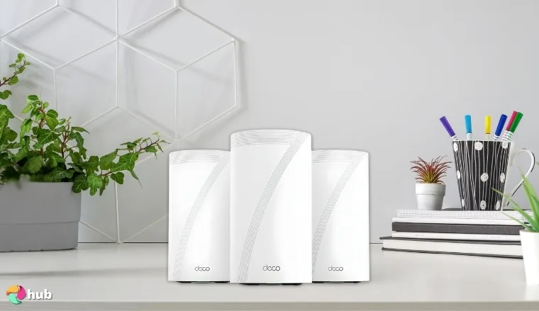 TP-Link Deco BE95 Wi-Fi 7 Mesh-Ready System on a white office desk with professional arrangement for a review