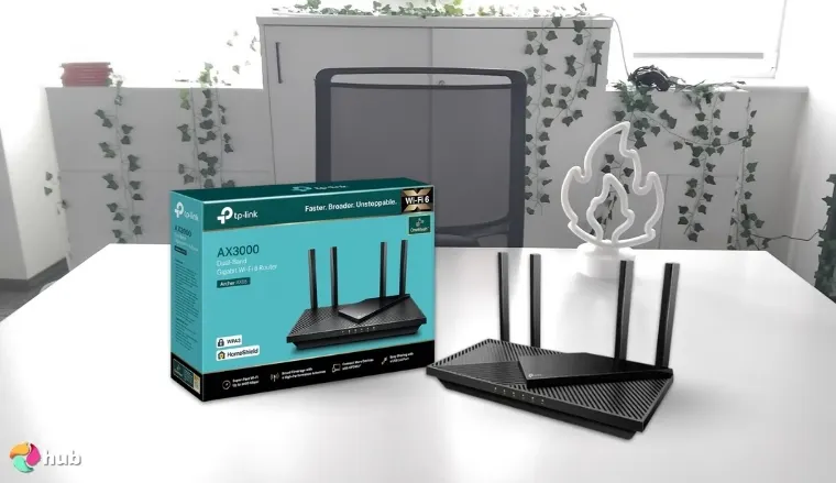 TP-Link Dual-Band AX3000 Wi-Fi Router on a white office desk prepared for product photography