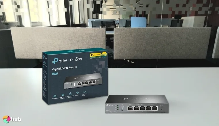TP-Link ER605 V2 VPN Router on a white office desk with soft lighting for a review