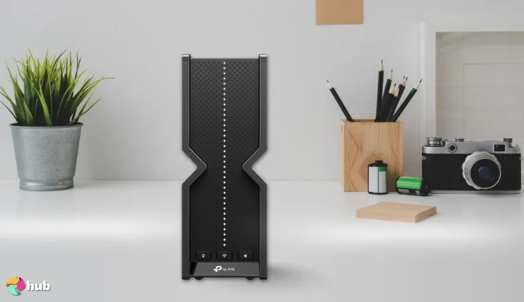 TP-Link Tri-Band BE15000 Wi-Fi 7 Router on a white office desk set for a professional product review