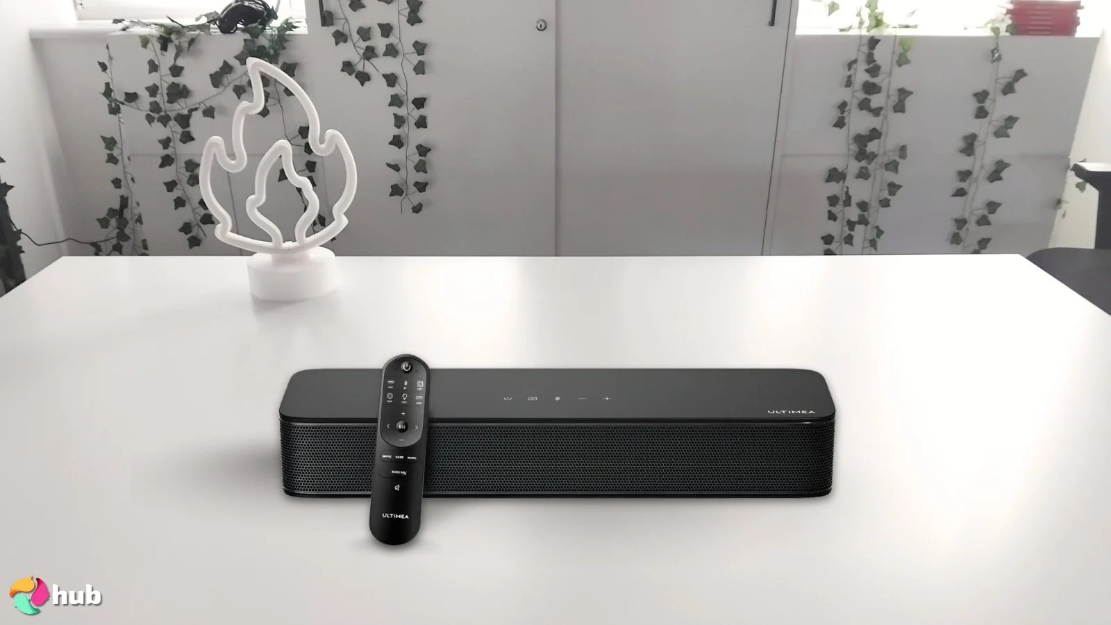 ULTIMEA Solo B30 Pro Soundbar on a white office desk in a well-lit setting for a review