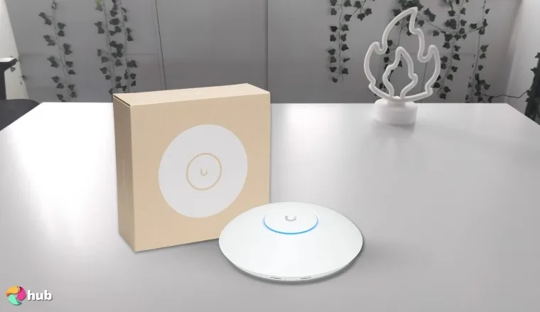 Ubiquiti Networks UniFi 7 Pro Wi-Fi 7 Router on a white office desk with an uncluttered background for a review