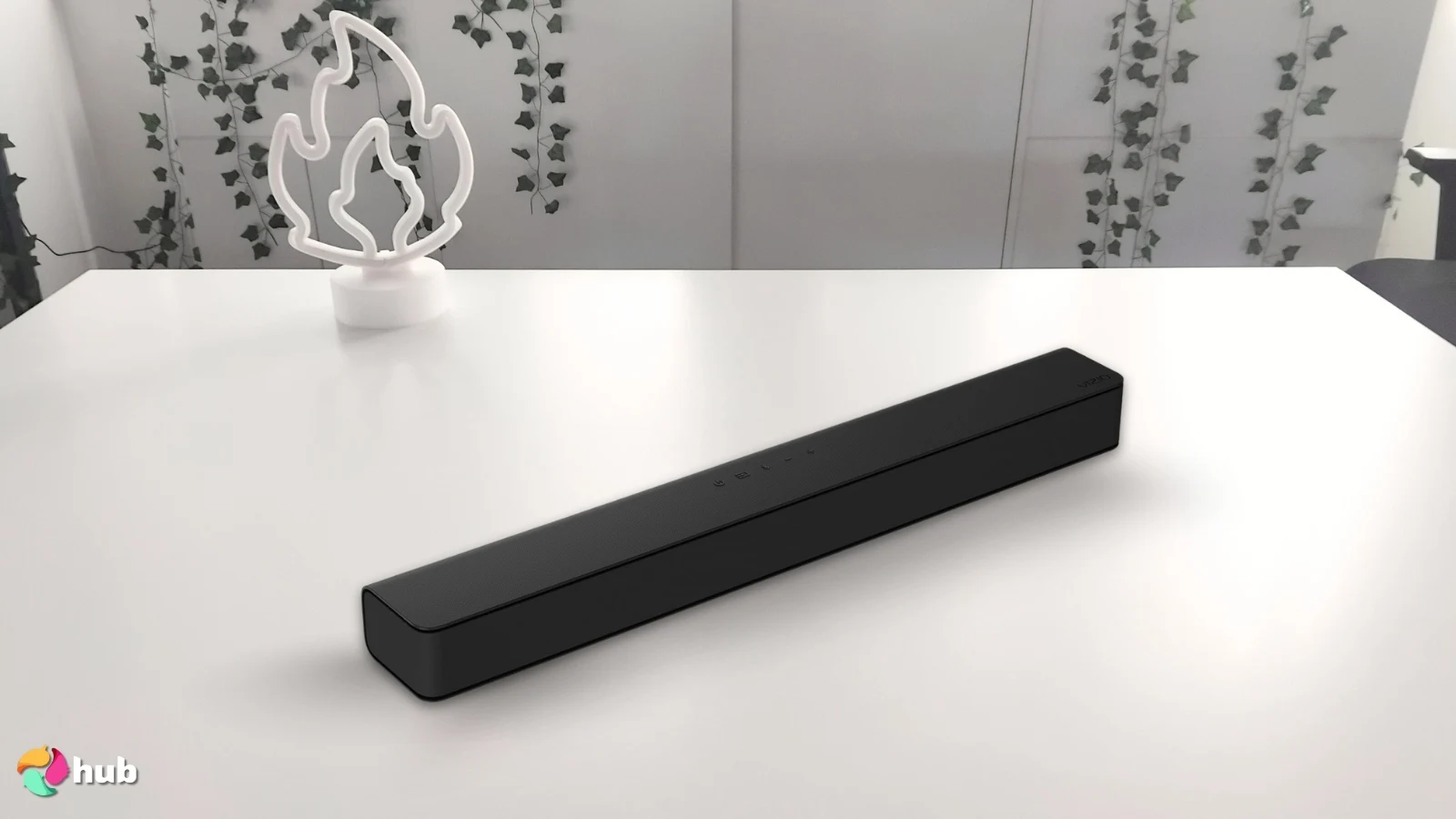 VIZIO V-Series 2.1 Soundbar on a white office desk with minimal decor for a review