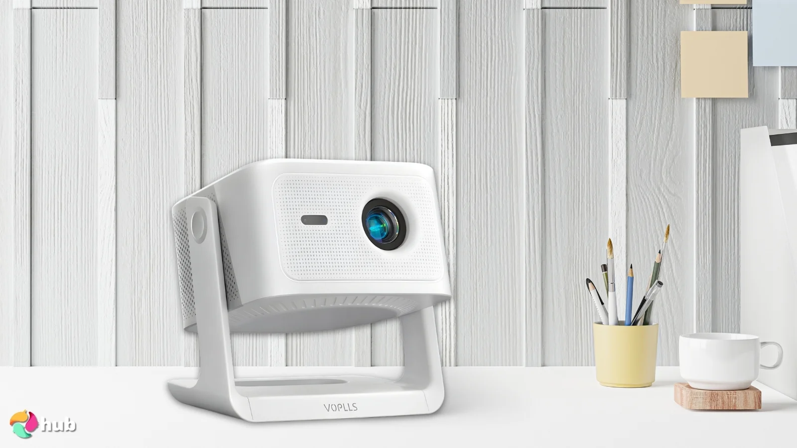 VOPLLS WiFi/Bluetooth 1080P/4K Support Projector on a white office desk prepared for testing shots