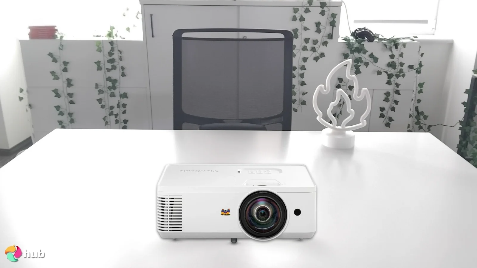 ViewSonic PS502W Projector on a white office desk in a well-lit setting for a review