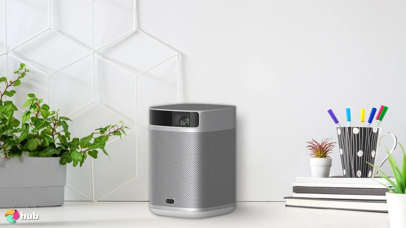 XGIMI Mogo 2 Pro Portable Projector on a white office desk styled neatly for a review