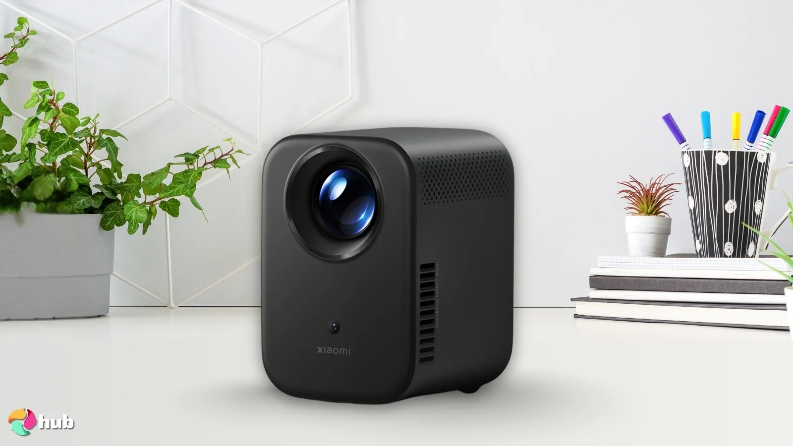 Xiaomi Smart Projector L1 on a white office desk styled neatly for a review