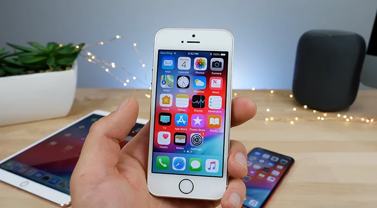 Hand holding an iPhone