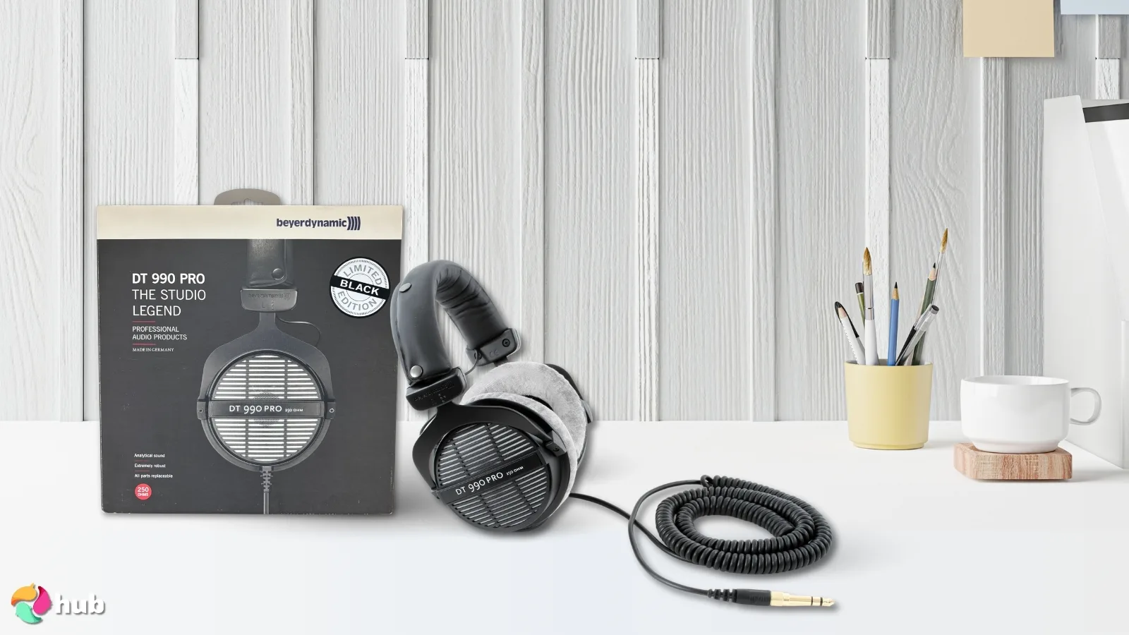 beyerdynamic DT 990 Pro X Headphones on a white office desk with neat arrangement for a review