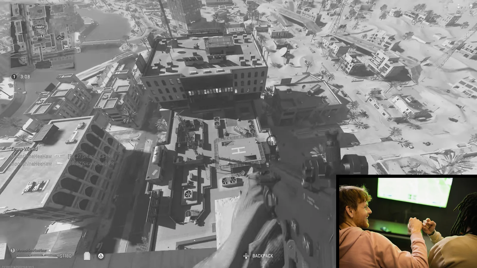 In-game CoD mobile screenshot with two people picture in the corner