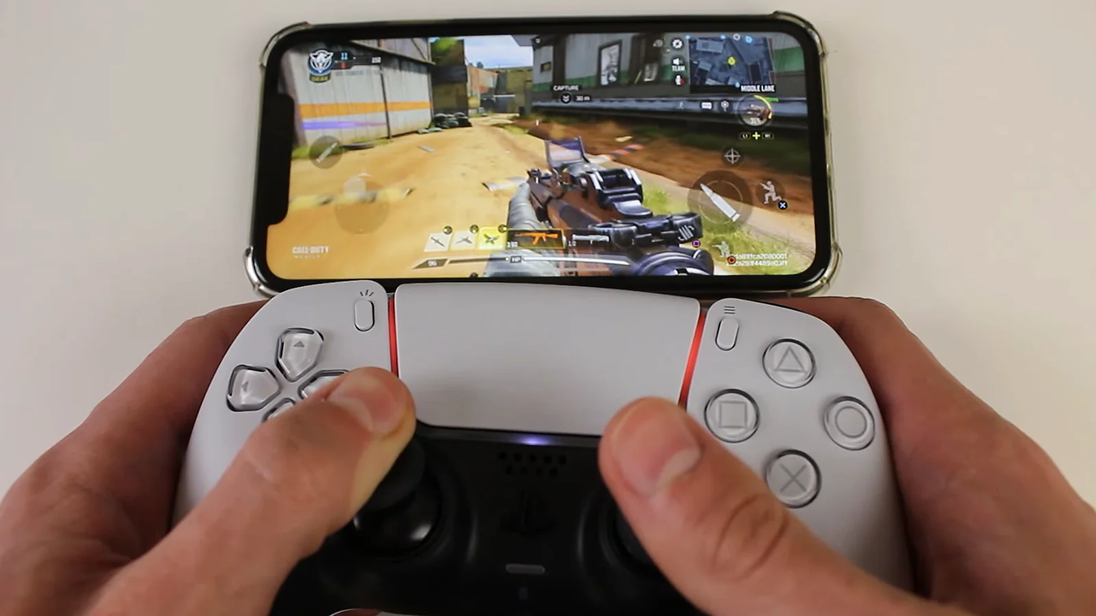 A man playing COD mobile on controller